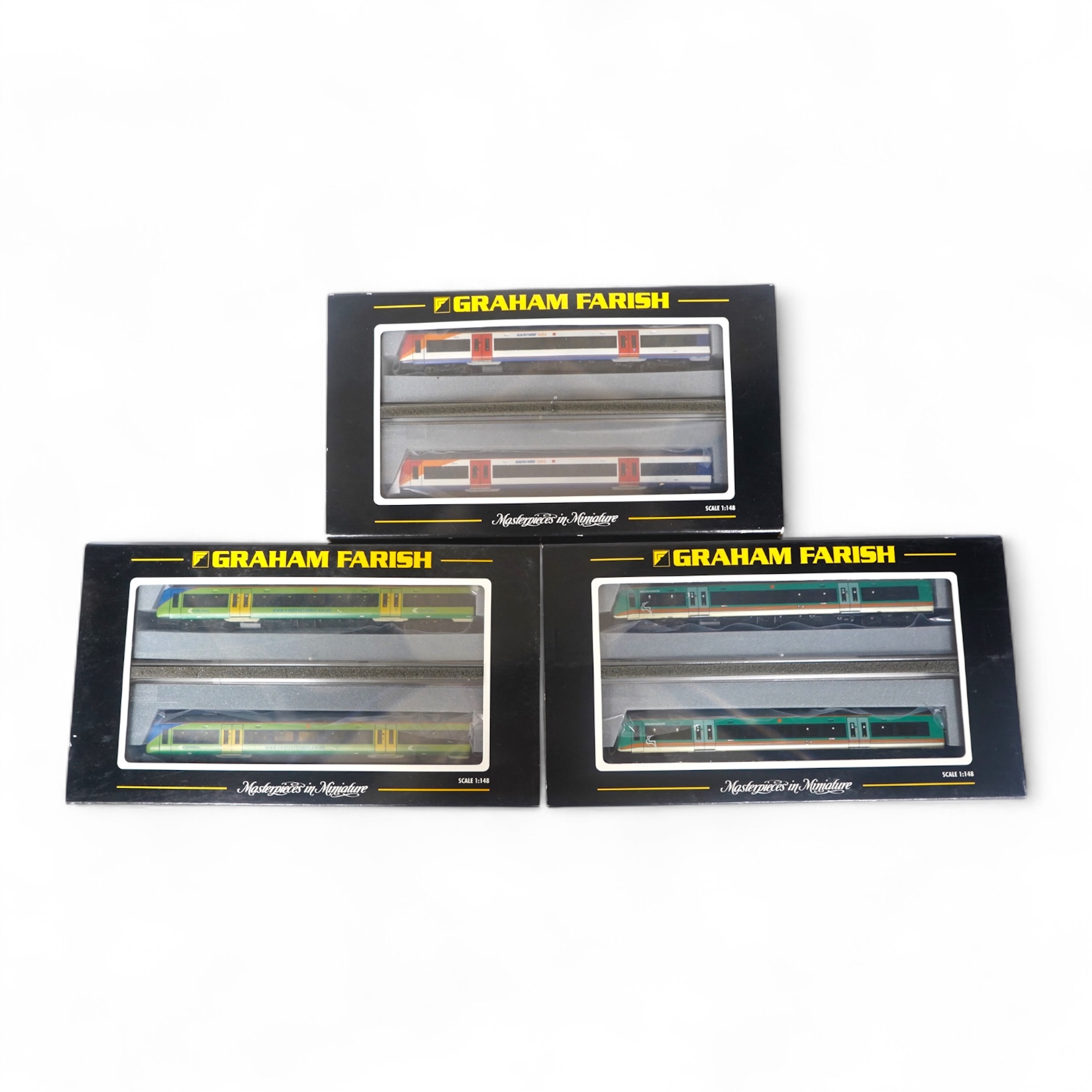 Three boxed Graham Farish N gauge railway DMU train packs; a South West Trains 170/4 2-car DMU (371-427), a Midland Mainline 170/1 Turbostar 2-car DMU (371-425), and a Central Trains Turbostar 170/5 2-car DMU (371-426).